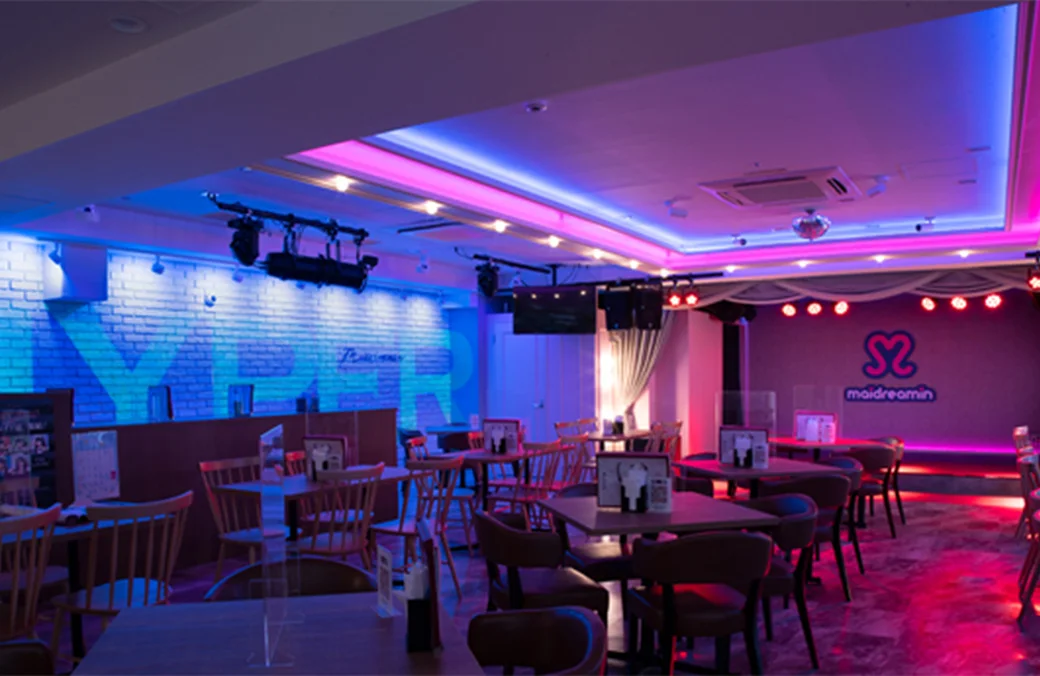 Café interior bathed in stage lights